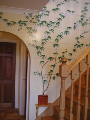 Trompe l'oeil passion flower mural next to the stairs