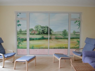 Patio doors have been painted to trick the eye in true trompe l'oeil mural style