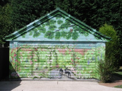 An outdoor mural painted on a garage