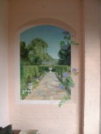 Open up a porch area by painting a trompe l'oeil view