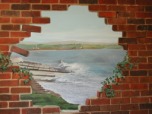 Trick the eye with a genuine brick wall opening painted on a panel